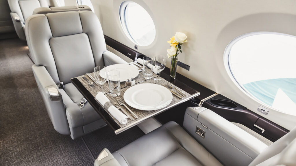 Private Jet Travel is Luxurious, Private, Safe, and Secure - Luxury charter aircraft interior seating for in flight dining experience